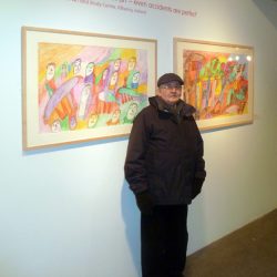 The artist in front of his work