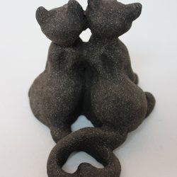 Black clay cats by Christina SooJa Massey