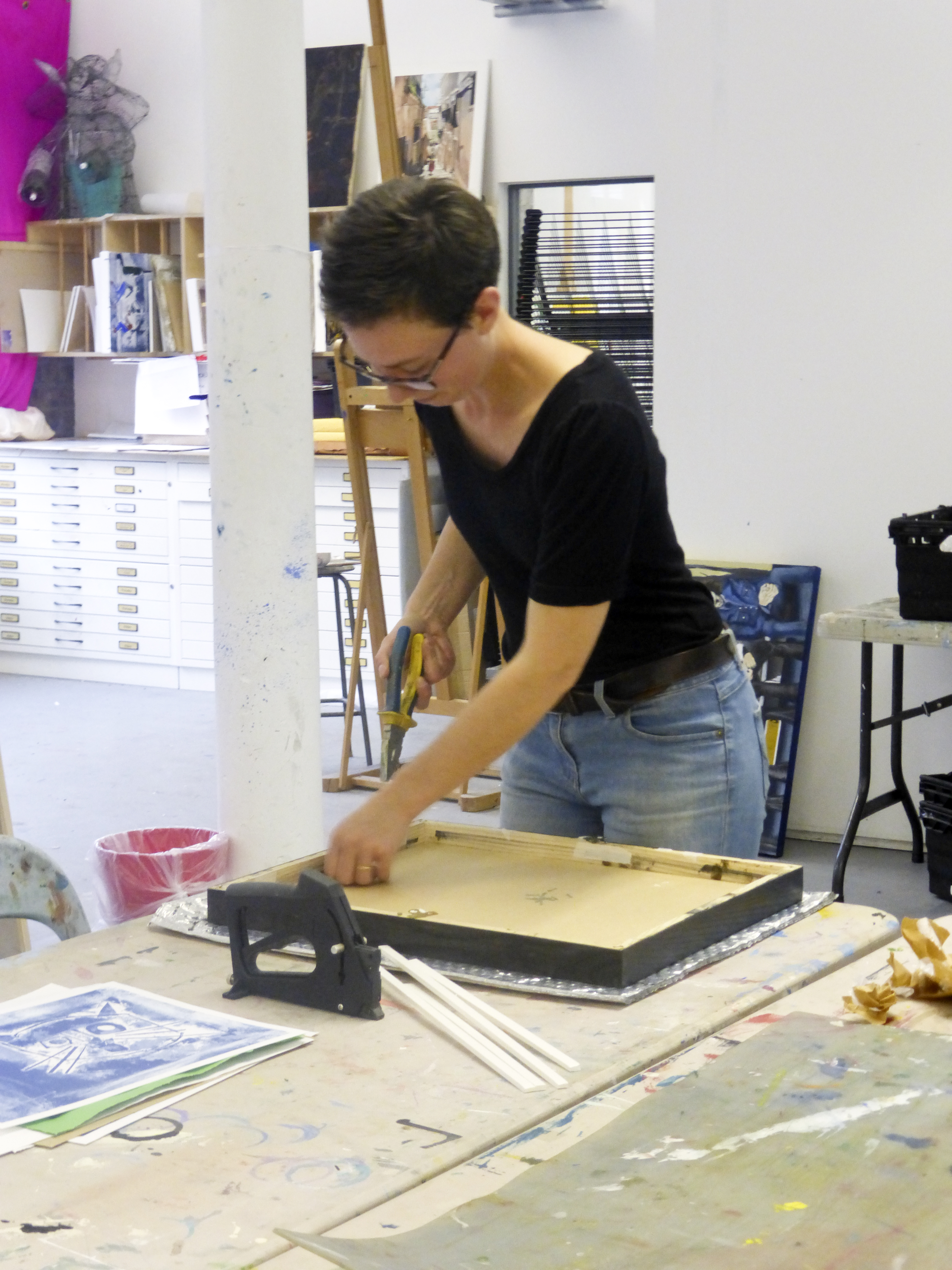 Volunteer Hana Wilde printing