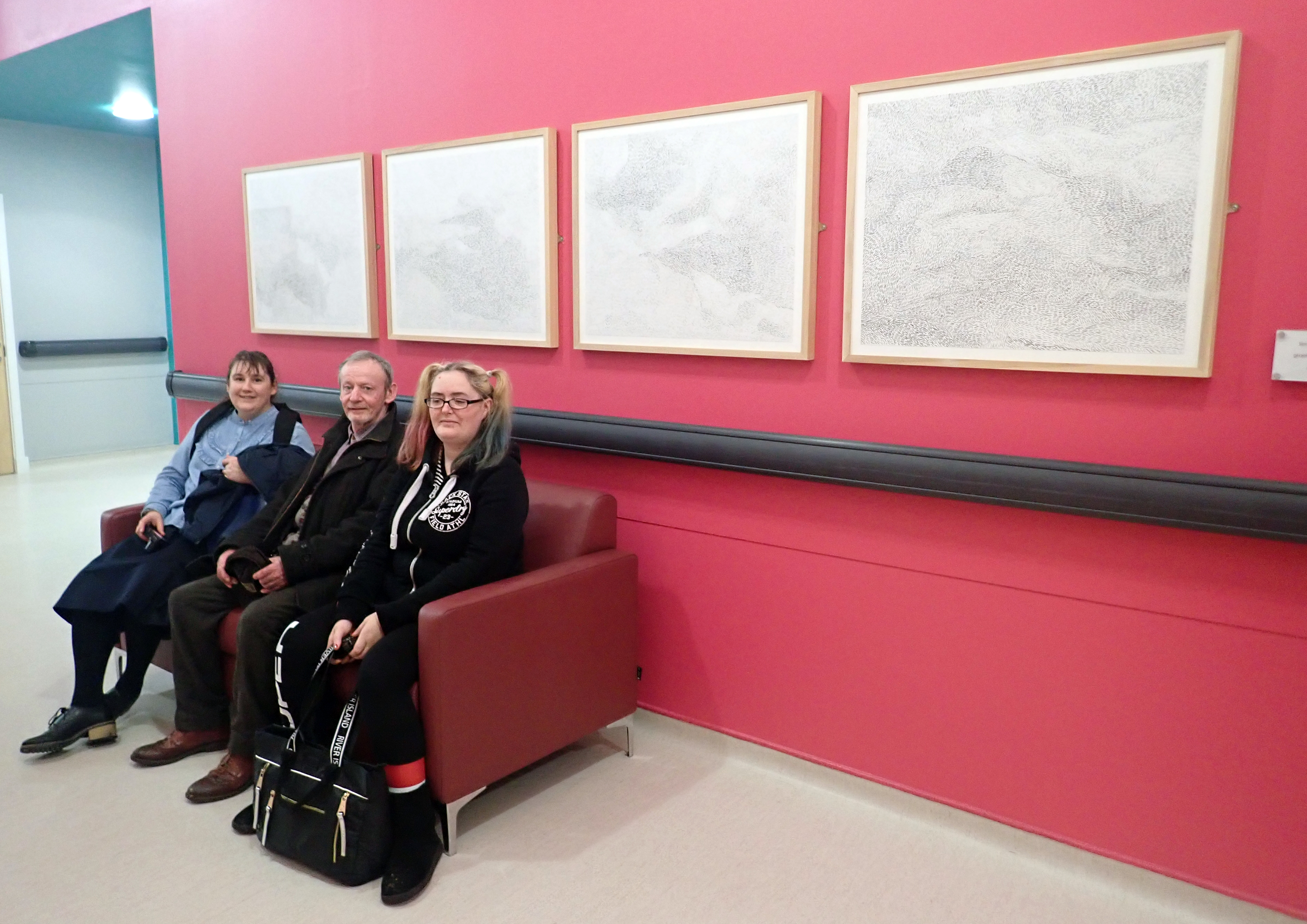 Artists sitting in front of work in Gartnavel