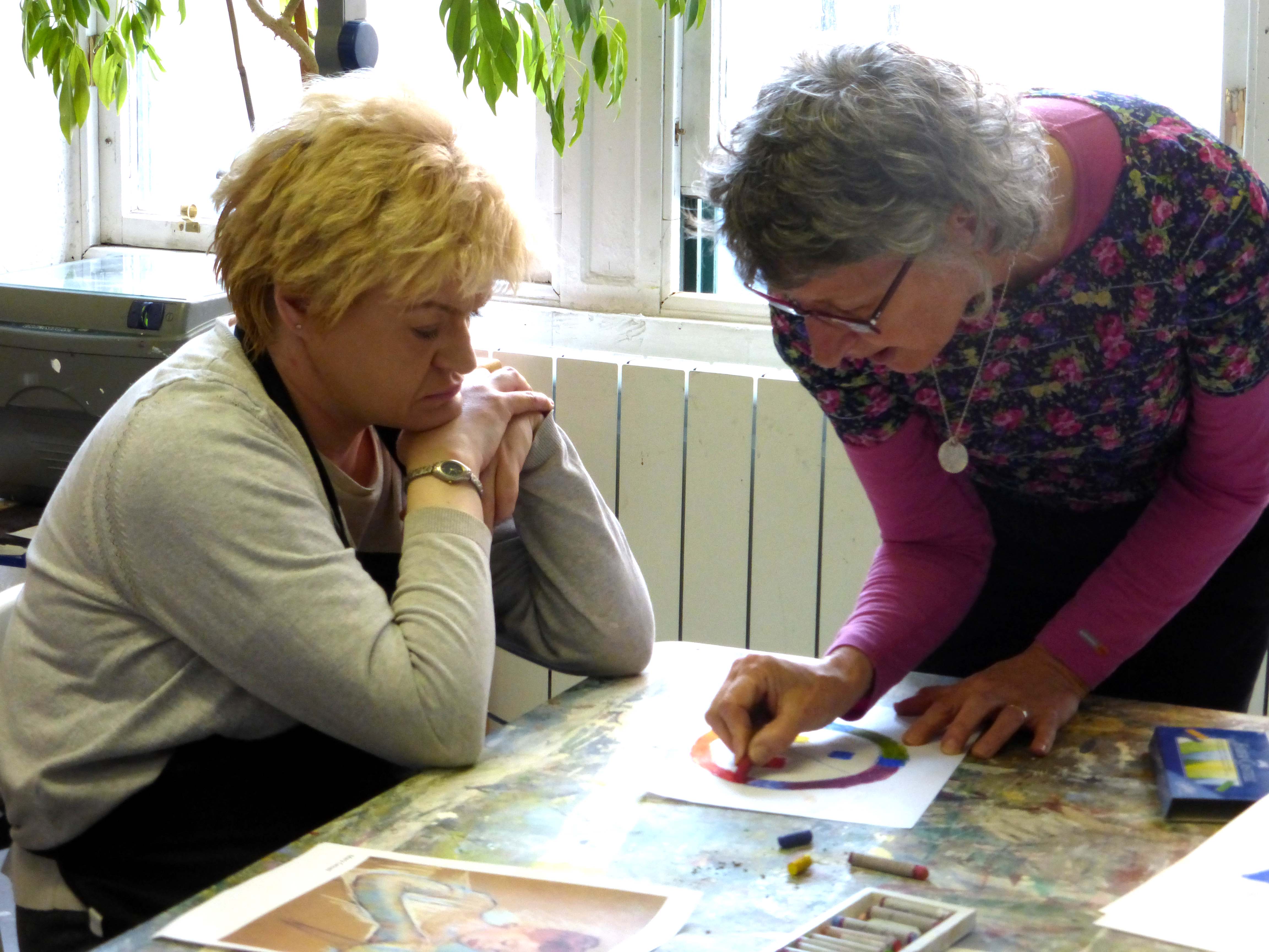 volunteer helping an artist at Project Ability