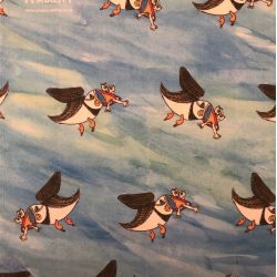 tea towel of blue sky with puffins by Cameron Morgan