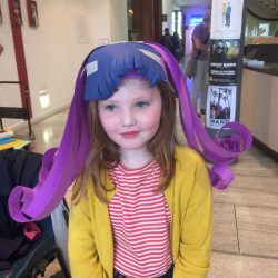 making paper wigs at project ability, merchant city festival
