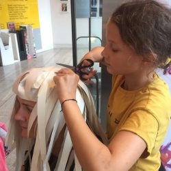 making paper wigs at project ability, merchant city festival