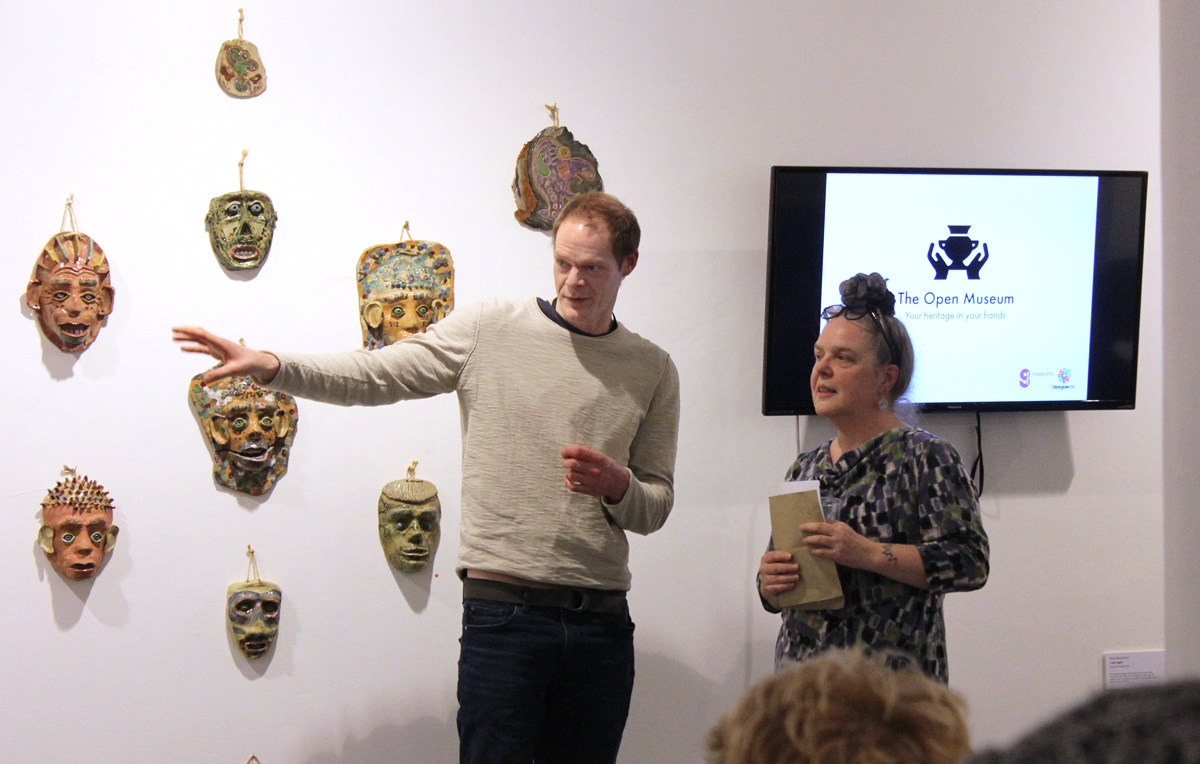 Two of the exhibiting artists standing in the gallery talking 
