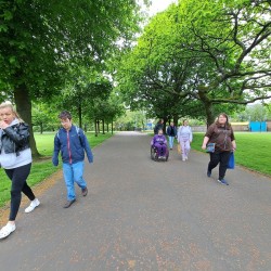 the grooup walking through Glasgow Green