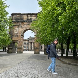A walker near the entrance to Glasgow Green