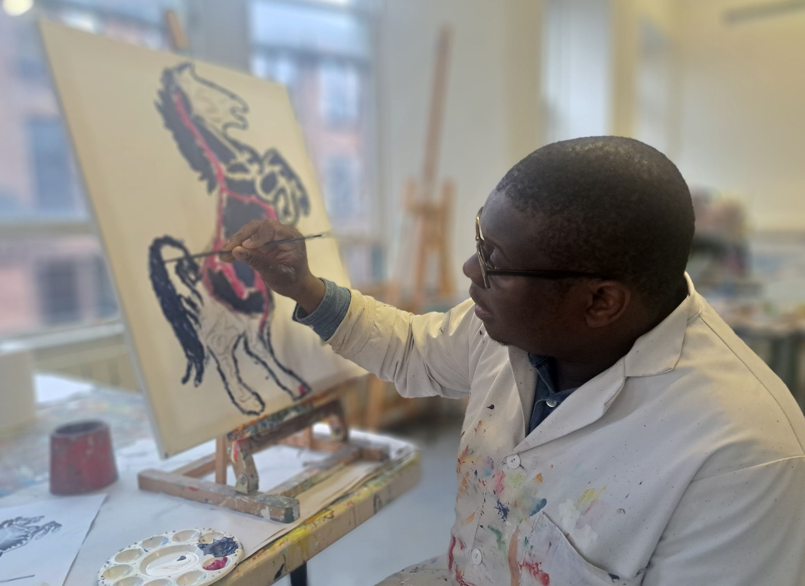a young person painting a horse on a canvas held by an easel