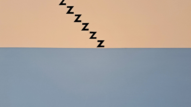 An art piece that is half blue and half peach. The peach coloured portion has a series of Z letters that are formed to look like black stairs.