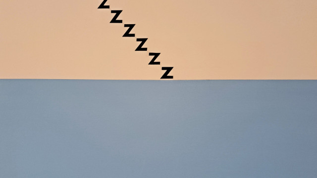 An art piece that is half blue and half peach. The peach coloured portion has a series of Z letters that are formed to look like black stairs.