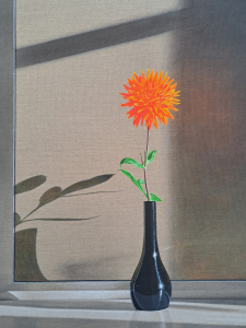 A close up of a painting shows a small shiny black vase holding 1 single flower. The flower has a skinny brown stem, a few green leaves and the flower head is orange, round and spiky. The vase is sitting on a white shiny surface and you can see the shadow of the vase and flower.