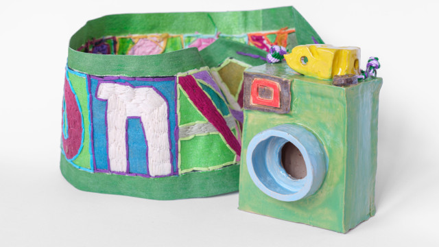 ceramic camera with embroidered strap