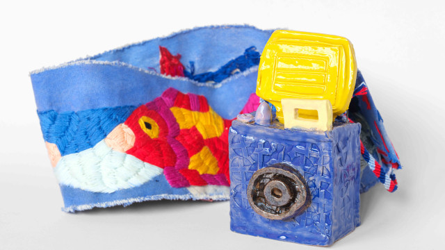 ceramic camera with embroidered strap